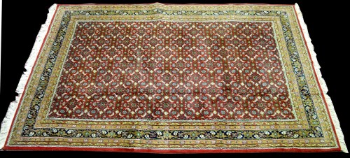Lot 899 - A Bidjar carpet, the red ground with small...