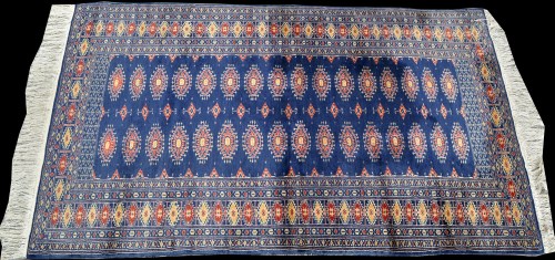 Lot 905 - A Pakistan Bokhara rug, the blue field with...