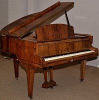 Lot 955 - A baby grand piano in walnut case, by Challen,...