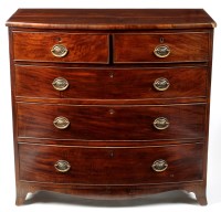 Lot 965 - A George III mahogany bowfront chest of two...