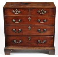 Lot 987 - A George III mahogany chest of two short and...