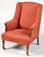 Lot 1000 - A wing easy chair, upholstered in salmon pink...