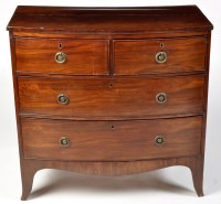 Lot 1012 - A George III mahogany bowfront chest of two...