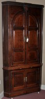 Lot 1040 - An 18th Century oak corner cupboard, the...