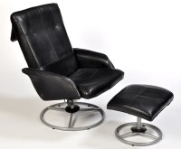 Lot 10 - A black leather reclining armchair on grey...