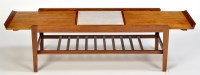 Lot 15 - Remploy: a teak coffee table, the top sliding...