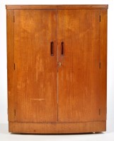 Lot 19 - A dark stained teak cocktail cabinet, the...