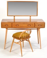 Lot 26 - Ercol: a light stained elm dressing table, the...