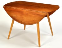 Lot 35 - Ercol: an elm drop leaf dining table, the oval...