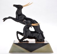 Lot 187 - An Art Deco patinated bronze group of antelope,...