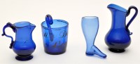 Lot 353 - Two blue glass cream jugs and blue glass mug...