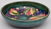 Lot 405 - Moorcroft 'Leaf and Berry' pattern bowl, the...