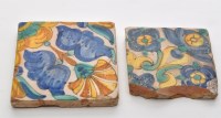 Lot 478 - Two polychrome tiles, with floral bursts and...