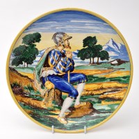 Lot 480 - Maiolica circular dish, painted with pensive...