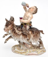 Lot 484 - Meissen figure of a Bacchic satyr astride a...