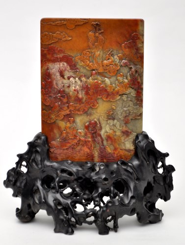 Lot 574 - Chinese carved soapstone panel, decorated with...