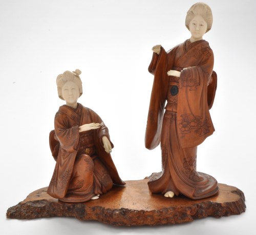 Lot 584 - A pair of 19th Century carved wood and ivory...