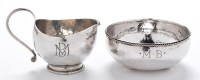 Lot 604 - A George V sugar bowl and matching cream jug,...