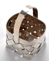 Lot 712 - A Cartier sterling basket, with oval rim and...
