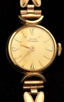 Lot 799 - Girard-Perregaux: a ladies 9ct. gold bracelet...