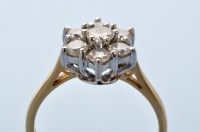 Lot 827 - A diamond cluster ring, the brilliant cut...