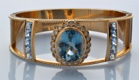 Lot 831 - A paraiba tourmaline, diamond and synthetic...