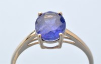 Lot 835 - A tanzanite ring, the oval facet cut tanzanite...