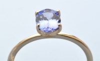 Lot 836 - A tanzanite ring, the oval facet cut tanzanite...