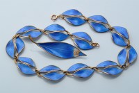 Lot 842 - A silver and blue enamel necklace, brooch and...