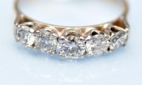 Lot 847 - A five stone diamond ring, the graduated...