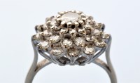 Lot 848 - A diamond cluster ring, the central brilliant...