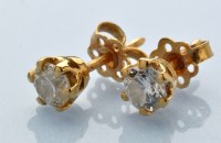 Lot 864 - A pair of diamond stud earrings, the brilliant...