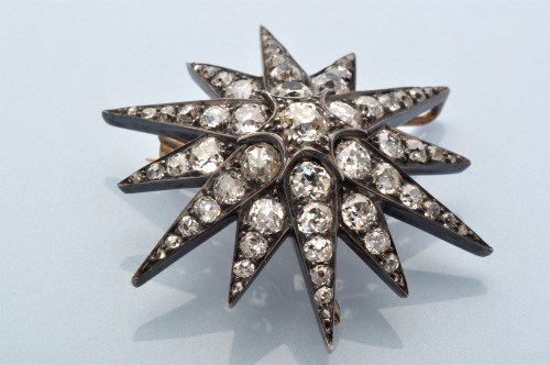 Lot 876 - A diamond star brooch, circa 1870, the...
