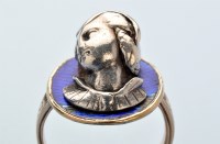 Lot 879 - A deep relief cameo ring, the white metal...