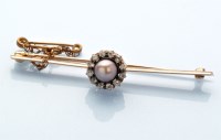 Lot 883 - A cultured black pearl and diamond cluster bar...