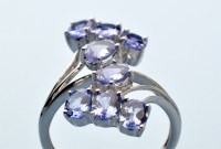 Lot 886 - A tanzanite dress ring, set with eight oval...