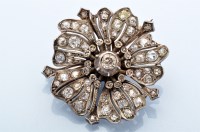 Lot 894 - A diamond flower pattern brooch, the central...