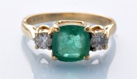 Lot 903 - An emerald and diamond ring, the circular...