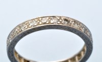 Lot 906 - A diamond eternity ring, the eight-cut...