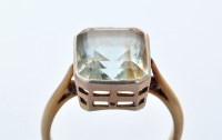 Lot 907 - An aquamarine ring, the emerald-cut aquamarine...