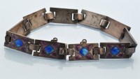 Lot 908 - An Edwardian enamelled silver bracelet, by...