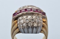 Lot 912 - A ruby and diamond dress ring, set with a...