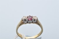 Lot 915 - A ruby and diamond ring, the circular facet...