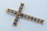 Lot 919 - A sapphire set crucifix pendant, the seventeen...