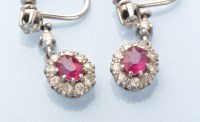 Lot 921 - A pair of ruby and diamond cluster drop...