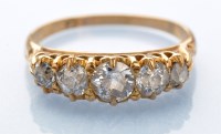 Lot 923 - A five stone diamond ring, the old cut...