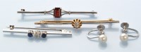 Lot 925 - A diamond set bar brooch, the old cut diamond...