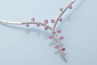 Lot 927 - A diamond, pink sapphire and 18ct. white gold...