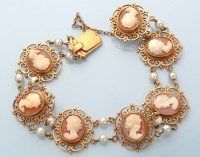 Lot 939 - A carved shell cameo bracelet, each of the...