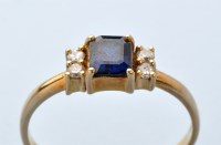 Lot 952 - A sapphire and diamond ring, the rectangular...